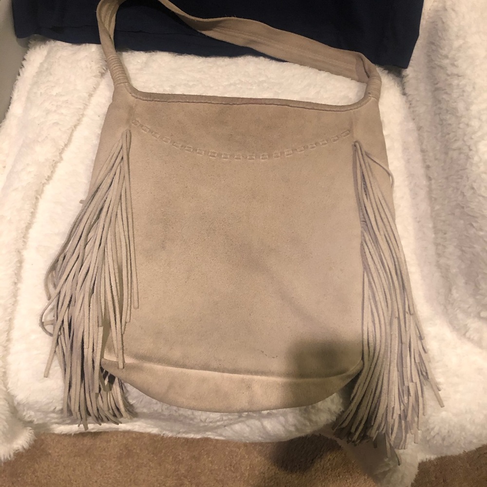Light tan suede bag with fringe